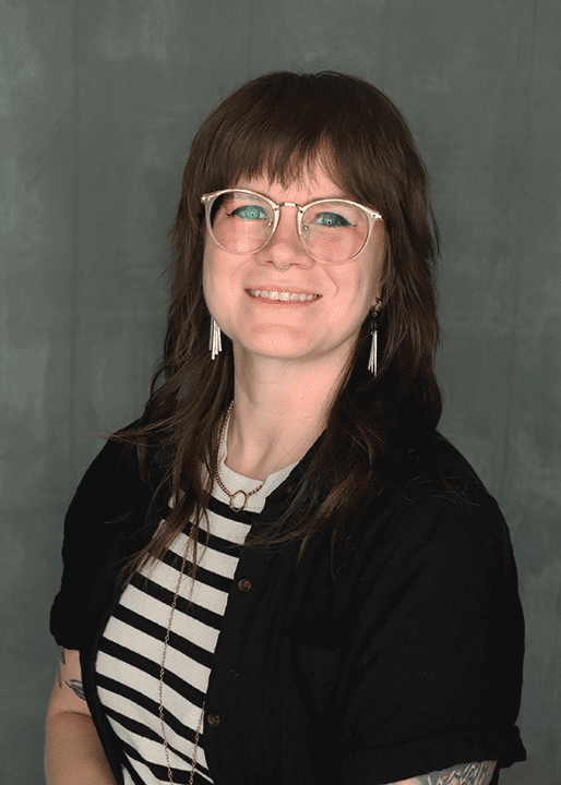 Artist sitting in chair has a haze from the film used